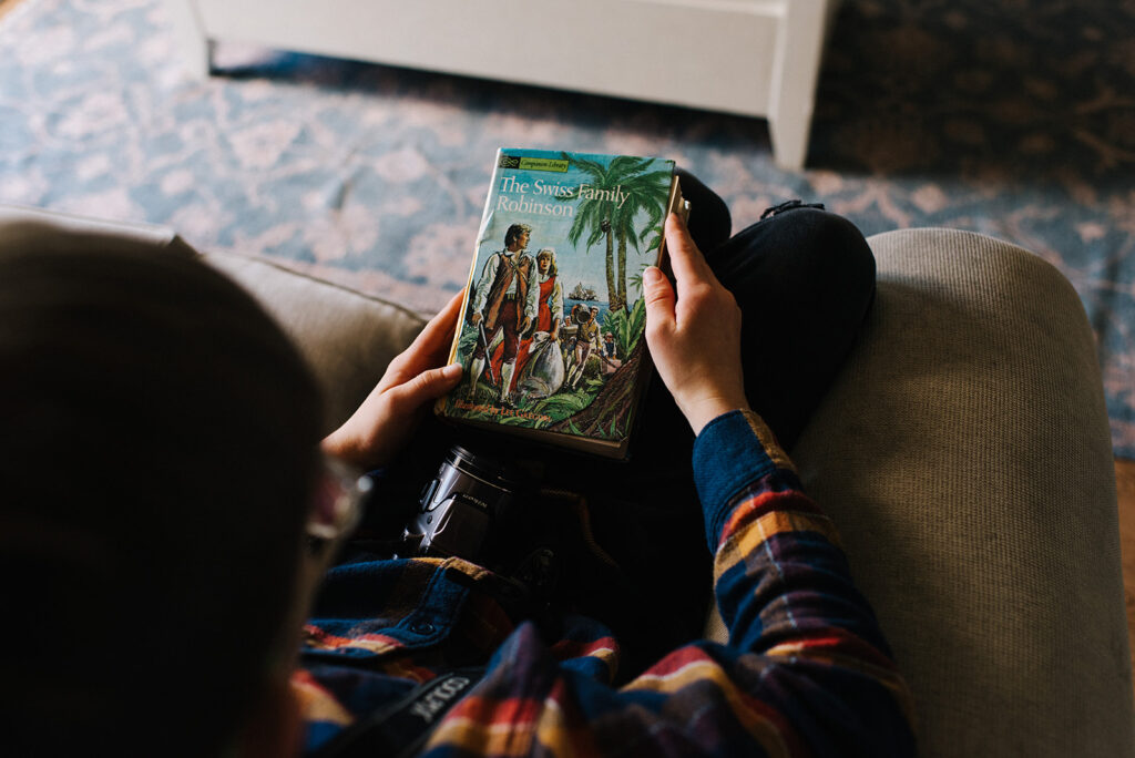 Photo from above of a child holding a book